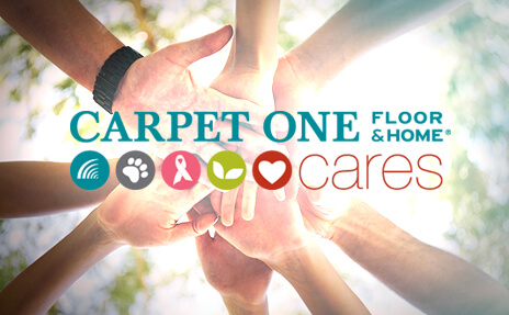 Carpet One Cares logo with hands together - corporate social responsibility